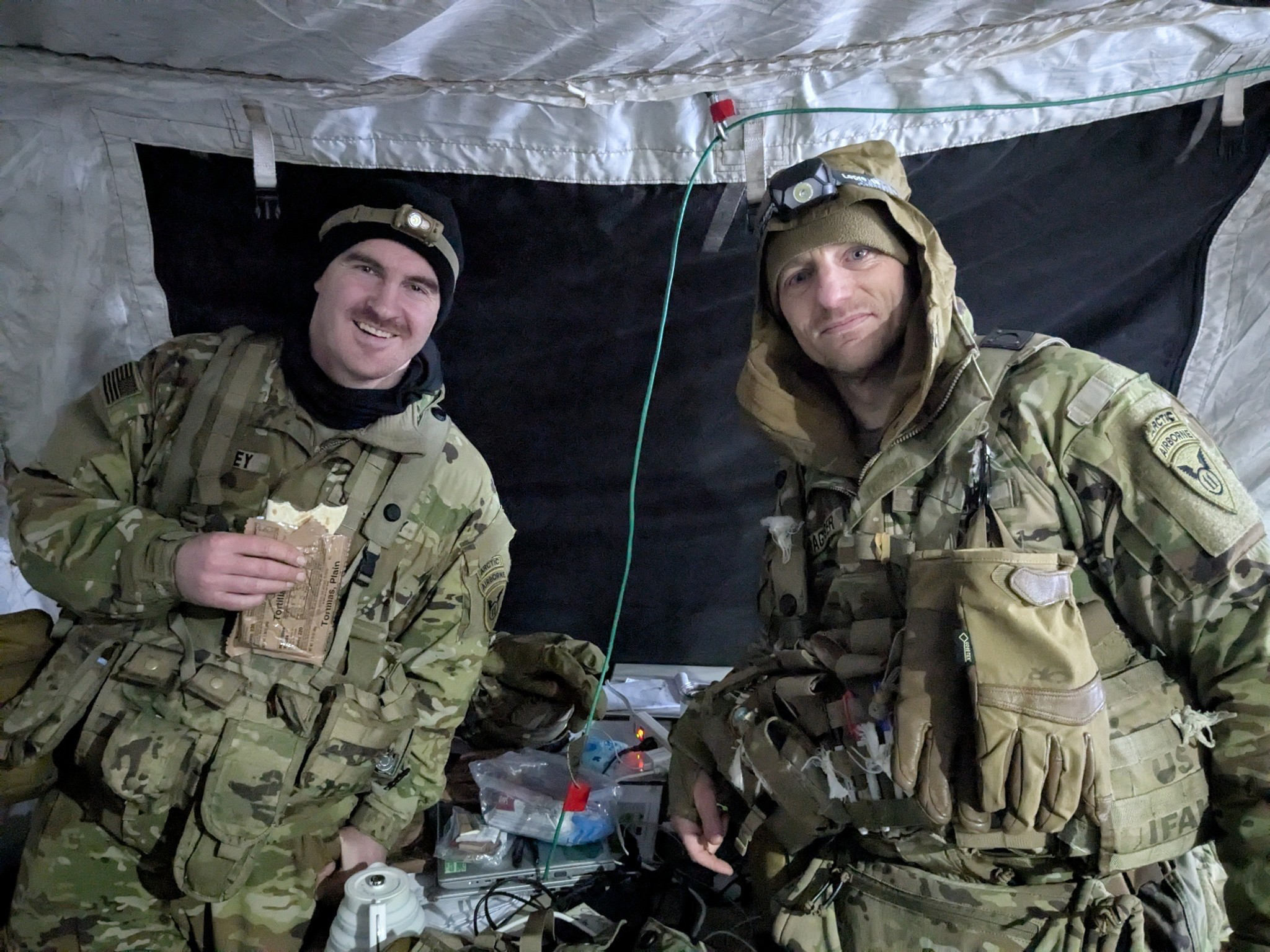 During Joint Pacific Multinational Readiness
            Center (JPMRC) 25-02 exercise in Alaska, CPT
            Seth Corley (left) and MAJ Jerome Trageser
            (right) conduct a Future Operations to Current
            Operations handover for the day’s actions.
            JPMRC 25-02 included Airborne, Air Assault,
            Airland, and Ground Assault Operations within
            the first 24 hours with temperatures dipping to
            -40° F. (Photo courtesy of SSG Johnnie Luna)